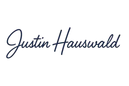 Unterschrift von Justin Hauswald in blauem Handschrift-Stil